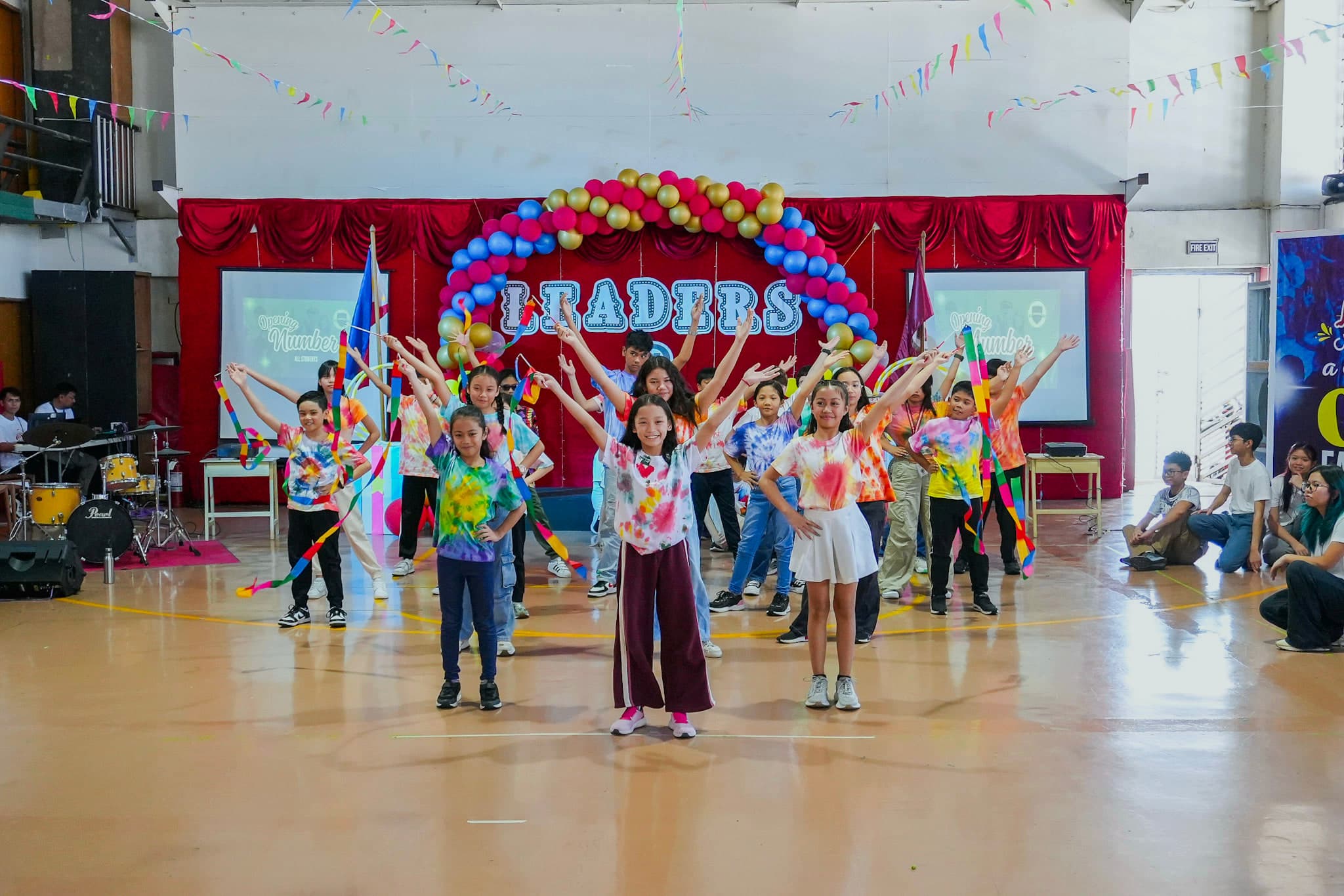 Students at Leaders performing together during a school program.