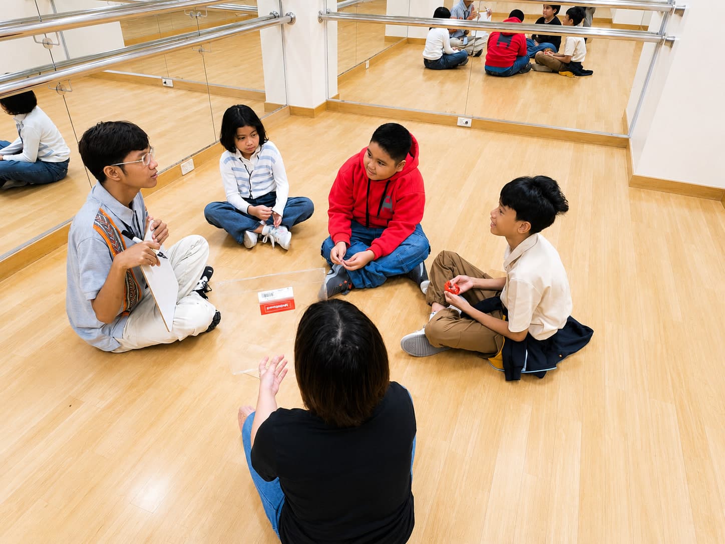 A small group of students at Leaders taking part in a guided discussion.