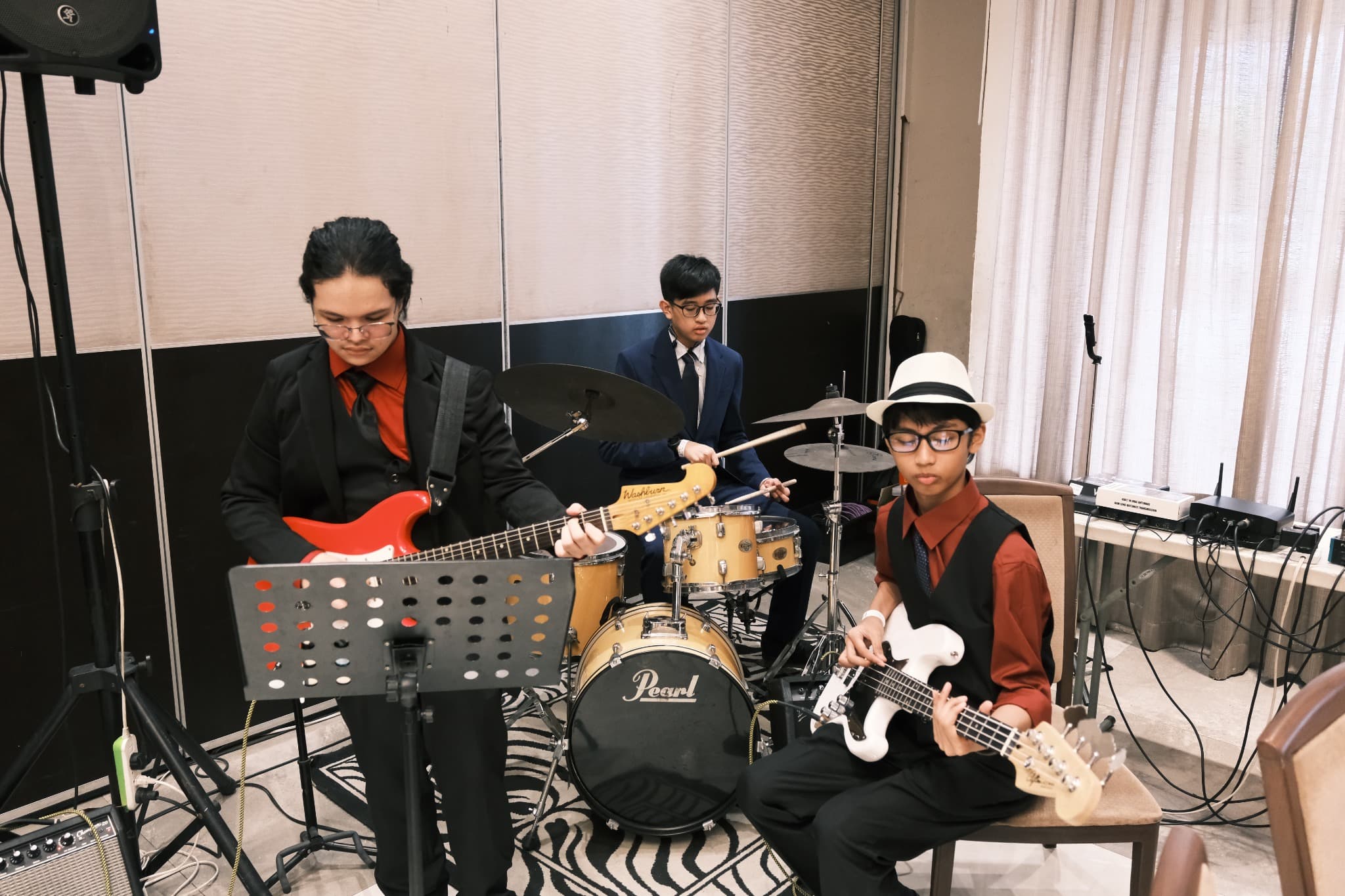 LICSM students performing together in a school band.