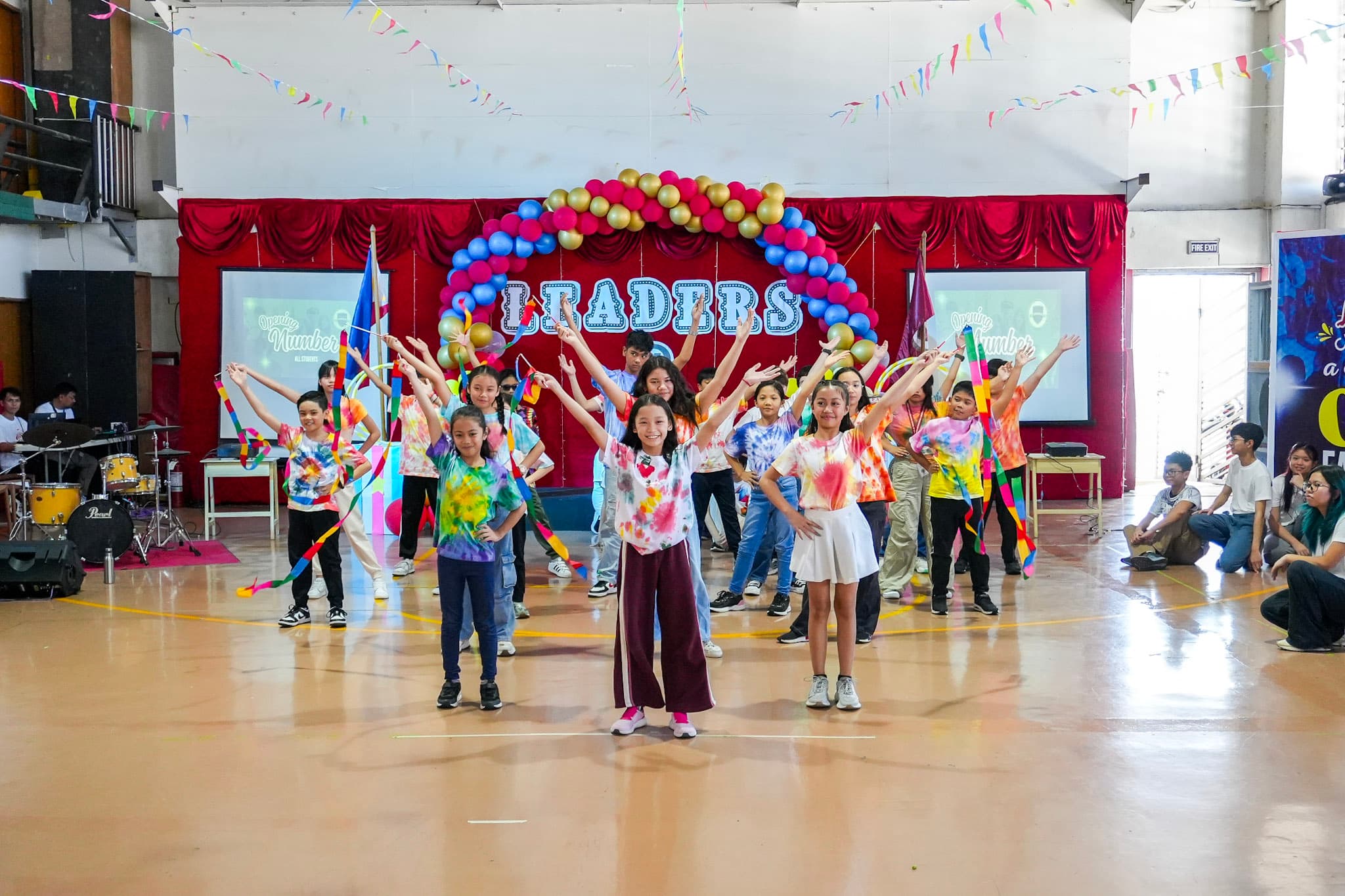 LICSM students performing together during a school celebration.