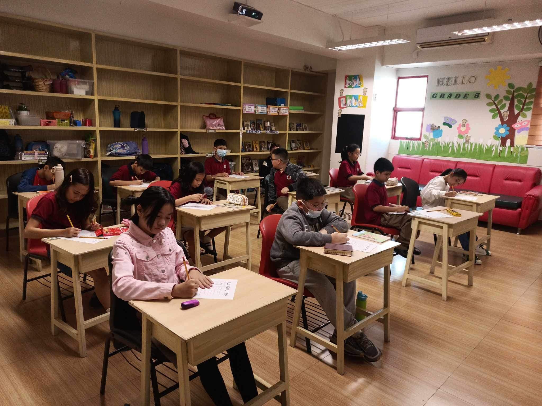 LICSM students learning in a small classroom setting.